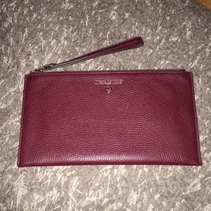 Michael Kors Nwot dark wine colored wristlet